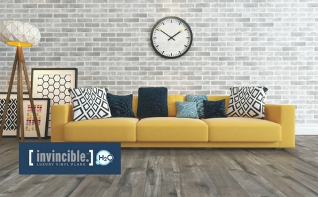 vinyl-plank-flooring with yellow sofa.